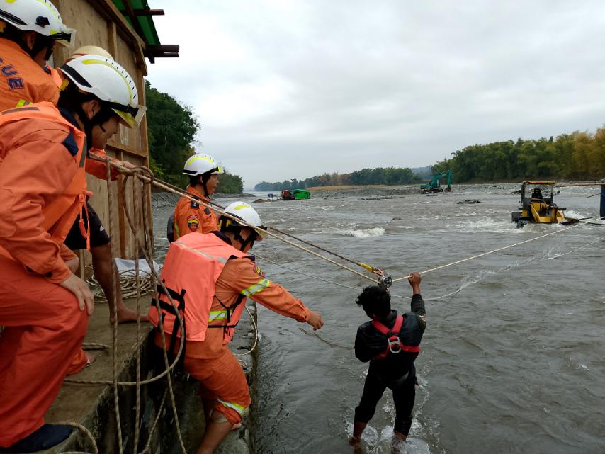 Firefighters rescue six workers and child stranded in a tent in the ...