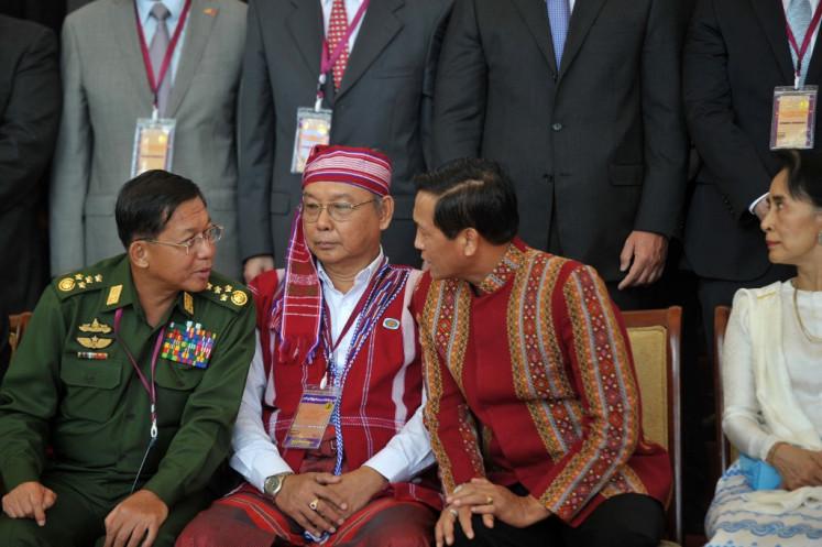 (Left-right) Myanmar military commander in chief Senior General Min Aung Hlaing, speaker of upper house of parliament Mahn Win Khaing Than and Vice President Henry Van Thio speak next to Myanmar State Counsellor and Foreign Minister Aung San Suu Kyi after