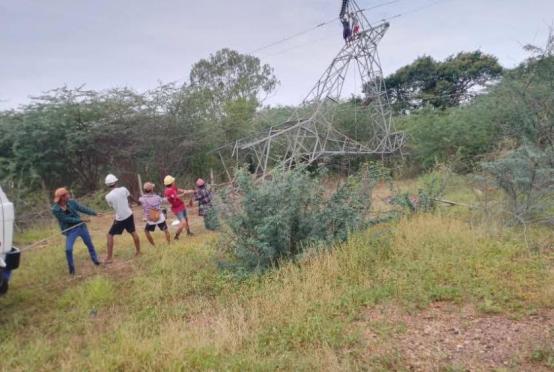 Photo - Workers repair a high-voltage transmission tower damaged in an explosion to restore electricity to towns across Pakokku District. (Facebook page of Pakokku Electricity Supplying Corporation)