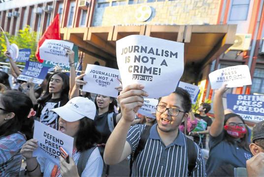 Students hold a rally at the University of the Philippines Diliman on Thursday to condemn the arrest of Rappler CEO Maria Ressa. —RICHARD REYES