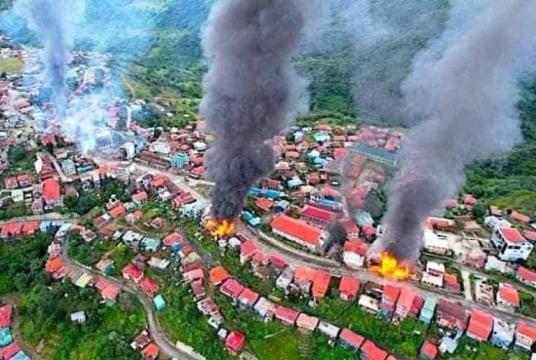Homes on fire in Thantlang in late October 2021 (Photo-TWITTER via The Straits Times / ANN)