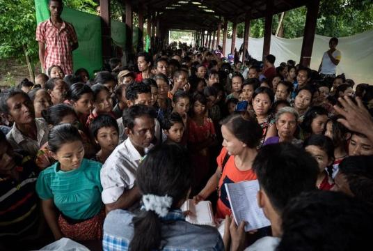 Residents displaced by floods waiting for food to be distributed at a monastery in Myanmar's Bago region on Aug 12. PHOTO: AFP