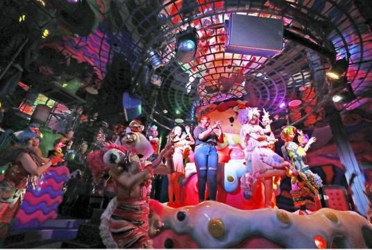 Foreigners take part in the show at Kawaii Monster Cafe Harajuku in Shibuya Ward, Tokyo, in July.