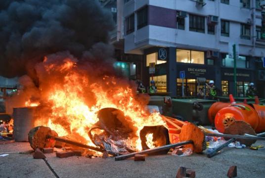 Protesters set a fire road block to slow police advancement at Wan Chai on Sept 29, 2019.ST PHOTO: CHONG JUN LIANG