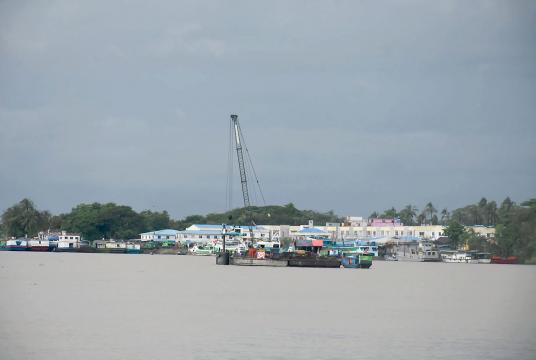 Ferries and cargo ships docked along Ngawun River in Pathein Township, yesterday evening