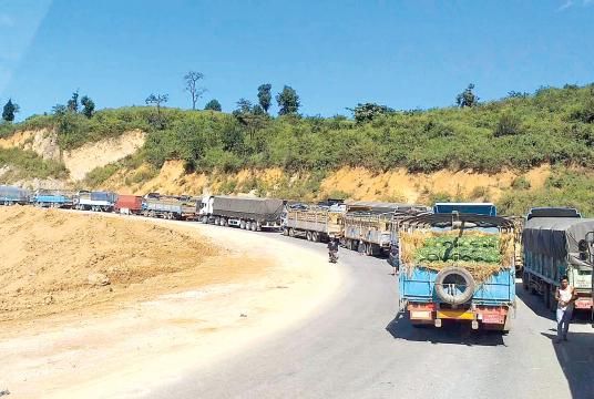 Cargo trucks and passenger buses are in a queue due to the clash between Tatmadaw and TNLA