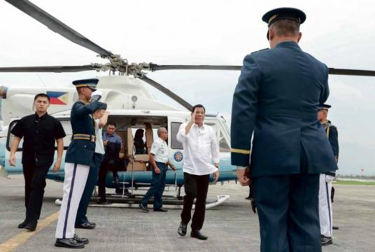 President Duterte returns the salute of military officers welcoming him to Villamor Air Base in Pasay City on Tuesday prior to his departure for Japan to attend the 25th International Conference on the Future of Asia. Sixteen Cabinet officials are traveling with the President as part of the 200-strong Philippine delegation to the annual gathering. —MALACAÑANG PHOTO