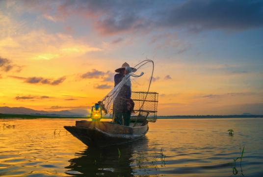 An unidentified fisherman catches fish. (Shutterstock.com/File)