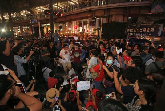 Activists hold a rally against the election delay at the Ratchaprasong Intersection in Bangkok on Tuesday.