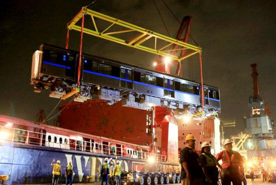 Workers unload MRT cars from a ship in Tanjung Priok Port, North Jakarta, on April 4, 2018. (The Jakarta Post/Seto Wardhana)