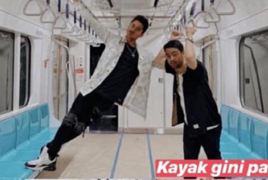 This picture uploaded to Instagram of jet ski athlete Aqsa Aswar (left) standing on a seat in an MRT car on Jan. 28 has sparked outrage online. (Via kompas.com/Instagram)