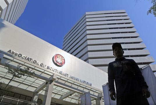 A man walks outside the ASEAN secretariat building in Jakarta shortly after its inauguration on Aug. 8, 2019. The Inauguration was held in conjunction with the 52nd anniversary of ASEAN. (JP/Seto Wardhana) 