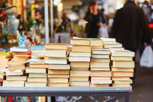 Old books wait for customers in a Parisian flea market. A literary event held a discussion about the role of literature in a developing a city. (Shutterstock/Ekaterina Pokrovsky)