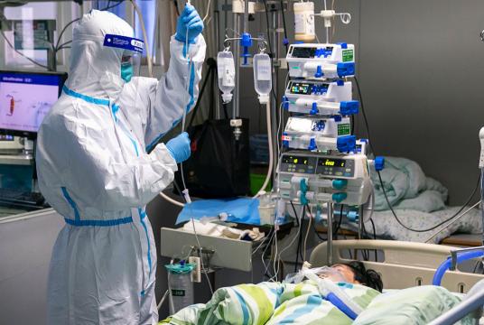 A patient with infected with the new strain of coronavirus is under treatment at a hospital in China. Yonhap