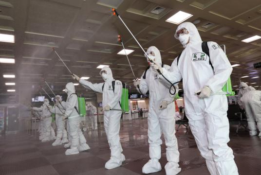 Soldiers disinfect Daegu Airport on Saturday. (Yonhap)