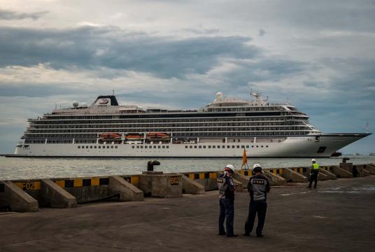 Officials stand guard as the Norwegian-flagged MV Viking Sun cruise ship docks at Tanjung Emas Port in Semarang, Central Java, on Thursday. (Antara/Aji Styawan)