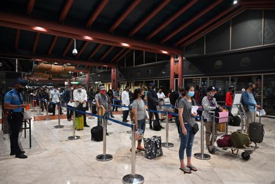 Travelers line up to have their documents checked prior to boarding at Soekarno-Hatta International Airport in Tangerang, Banten, on June 4. (AFP/Adek Berry) 