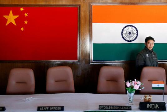 A man walks in a conference room used for meetings between military commanders of China and India, at the Indian side of the Indo-China border at Bumla, in the northeastern Indian state of Arunachal Pradesh. The Regional Comprehensive Economic Partnership (RCEP) has entered the legal scrubbing phase and is expected to be signed soon without India following its spat with China. (Reuters/Adnan Abidi) 