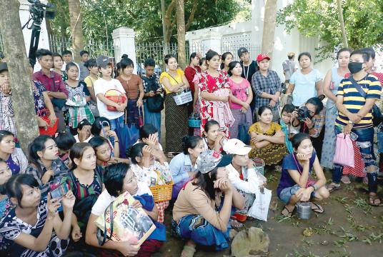 Some workers from five factories seen in front of the Yangon Regional Government Committee’s Office