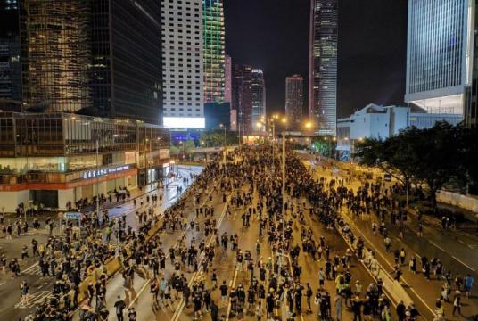 Thousands remain gathered outside the Central Government Complex, following the march from Victoria Park, with some turning their laser pointers on the government offices on Aug 18, 2019.ST PHOTO: LIM YAN LIANG