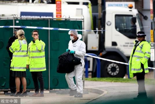 Police officer are seen at the scene where bodies were discovered in a truck in Grays, Essex, Britain Oct 23, 2019. [Photo/VCG]