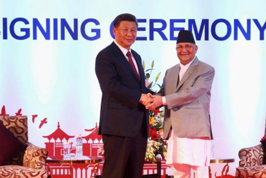 Chinese President Xi Jinping (left) and Prime Minister KP Sharma Oli shake hands after signing the agreements in Kathmandu on Sunday. RSS