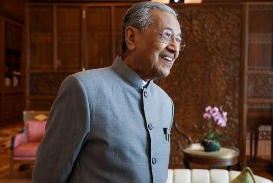 Malaysia's Prime Minister Mahathir Mohamad reacts during an interview with Reuters in Putrajaya.