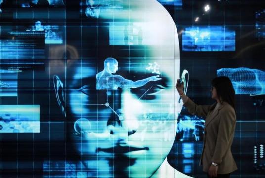 A visitor experiences artificial intelligence equipment at an exhibition in Yangzhou, Jiangsu province, on April 28, 2020. (MENG DELONG / FOR CHINA DAILY)