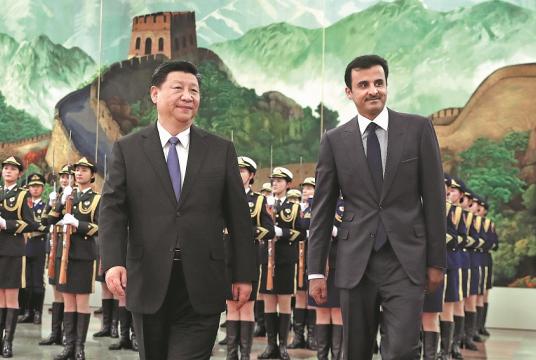 President Xi Jinping greets Qatari Emir Sheikh Tamim bin Hamad al-Thani at the Great Hall of the People in Beijing on Thursday. [Photo by Feng Yongbin/China Daily]