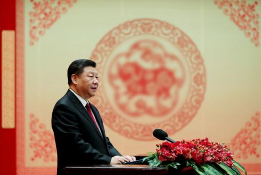 President Xi Jinping extends greetings to all Chinese people ahead of Spring Festival at a gathering at the Great Hall of the People in Beijing on Sunday./China Daily