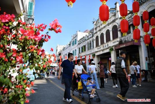 Tourists visit Qilou ancient street in Haikou, capital of south China's Hainan Province, Feb. 6, 2019, the second day of the Chinese Lunar New Year. (Xinhua/Guo Cheng)