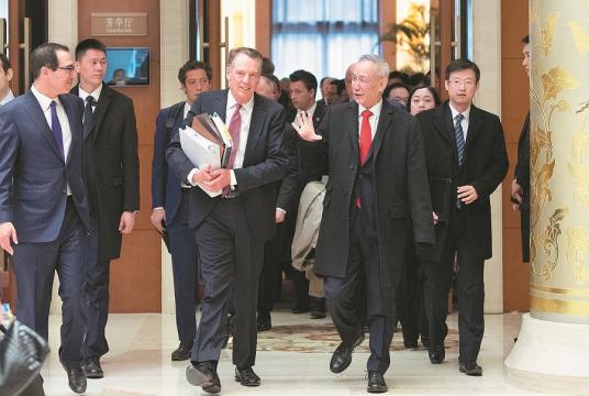 Vice-Premier Liu He, US Trade Representative Robert Lighthizer (center front) and US Treasury Secretary Steven Mnuchin (left) walk out of venue that was host to a new round of high-level economic and trade consultations in Beijing on Thursday. [Photo/Xinhua]