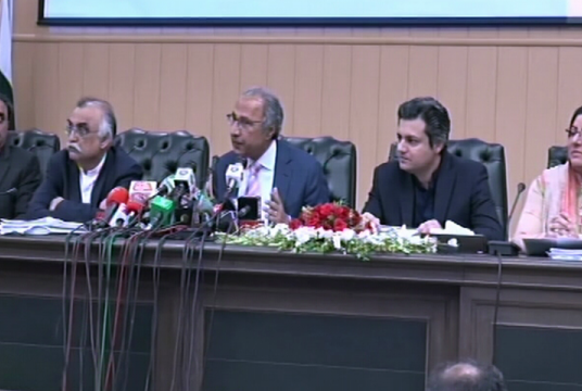 Adviser to the Prime Minister on Finance Dr Abdul Hafeez Shaikh (C) addresses a press conference in Islamabad on Tuesday. — DawnNewsTV