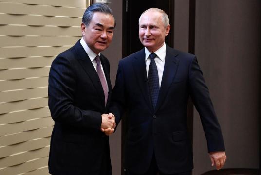 State Councilor and Foreign Minister Wang Yi meets Russian President Vladimir Putin in Sochi, Russia, on Monday. [Photo/Agencies]