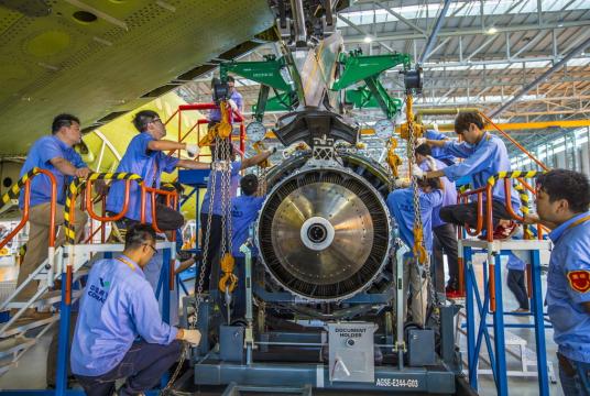 Chinese technicians assemble the fuselage of China's first domestically-developed passenger jet plane C919 at the assembly base of Commercial Aircraft Corporation of China, Ltd (COMAC) in Shanghai, China, Sept 25, 2015. [Photo/IC]