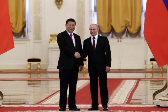 President Xi Jinping is greeted by Russian President Vladimir Putin at a welcoming ceremony in Moscow, Russia, on Wednesday, the first day of Xi's three-day visit to the country. [Photo by Kuang Linhua/China Daily]