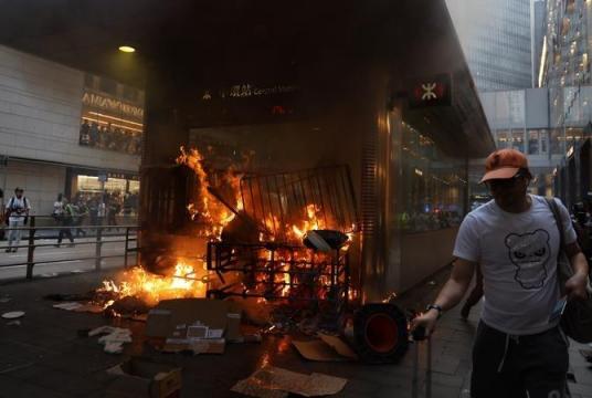 Fire rages at an exit of the Hong Kong subway's Central Station after radical protesters went on an arson spree on Sept 8, 2019. [PHOTO / CHINA DAILY]