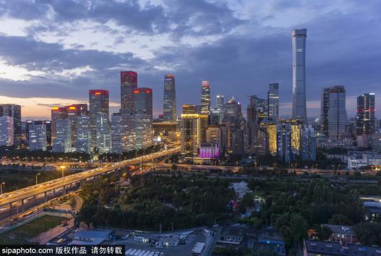 A photo shows a night view of the CBD area in downtown Beijing, capital of China. [Photo/Sipa] 