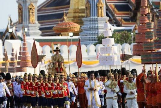 HM King Maha Vajiralongkorn is carried on a palanquin by royal guards during a procession around the old city, aimed at offering subjects a chance to pay homage to their new monarch. Nation/Wanchai Kraiaoenkhajit