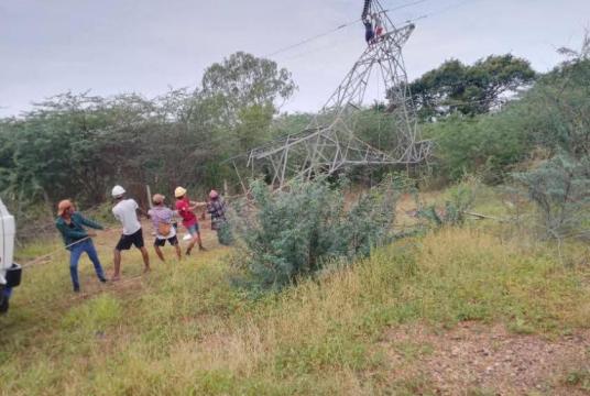 Photo - Workers repair a high-voltage transmission tower damaged in an explosion to restore electricity to towns across Pakokku District. (Facebook page of Pakokku Electricity Supplying Corporation)