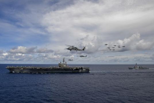 Aircraft fly in formation near the aircraft carrier USS Ronald Reagan, in the South China Sea, on July 5, 2020.PHOTO: EPA-EFE