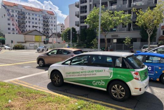 Demand for ride-hailing services, which is Grab's main business, has fallen amid the pandemic.ST PHOTO: DESMOND WEE