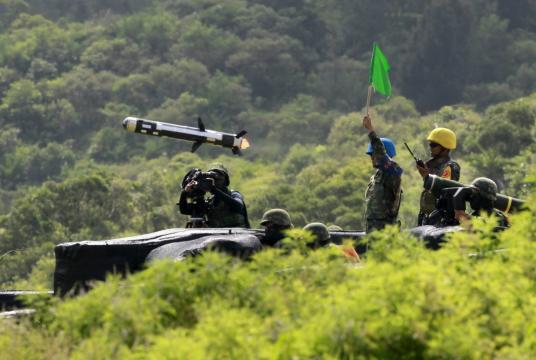 In this Thursday, Aug. 25, 2016 photo, Taiwanese soldiers launch an anti-tank weapon APILAS during the annual Han Kuang exercises in Pingtung county, southern Taiwan. (AP Photo/Chiang Ying-ying, File)