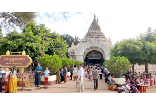 Caption: Visitors seen last week of December at the Ananda Pagoda