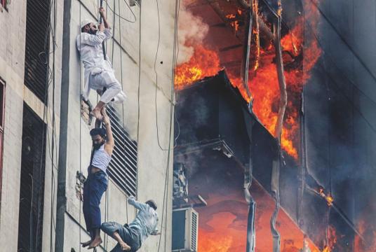 As fire engulfs the FR Tower in the capital’s Banani, some try to escape to safety Photo: Rashed Shumon and Amran Hossain