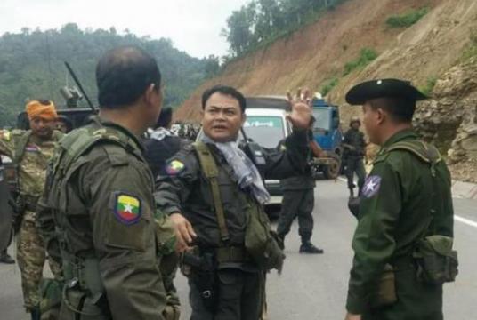 Colonel Saw Chit Thu (centre) seen during a security measure on Asia Road in Myawady. 
