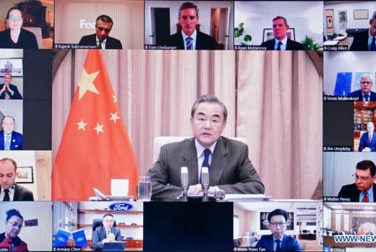 Chinese State Councilor and Foreign Minister Wang Yi attends a meeting with a delegation of board of directors of the US-China Business Council via video link in Beijing, capital of China, Dec 7, 2020. [Photo/Xinhua] 