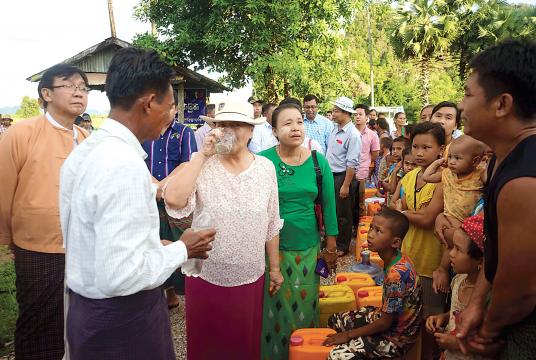 Photo shows Kayin State Chief Minister drinking water from lakes. 
