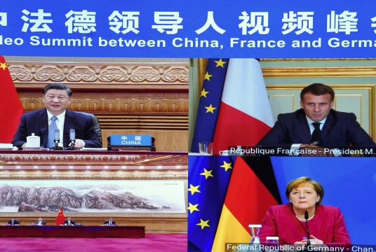 President Xi Jinping and French President Emmanuel Macron and German Chancellor Angela Merkel take part in a virtual summit on climate issues on Friday. They agreed to work on an equitable and reasonable climate governance mechanism and make it a pillar of Sino-EU cooperation. YUE YUEWEI/XINHUA
