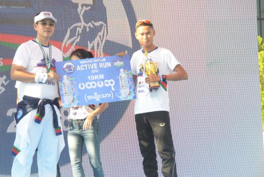 San Naing received the winner medal of 10km Challenge (male) (Photo-Sithu)